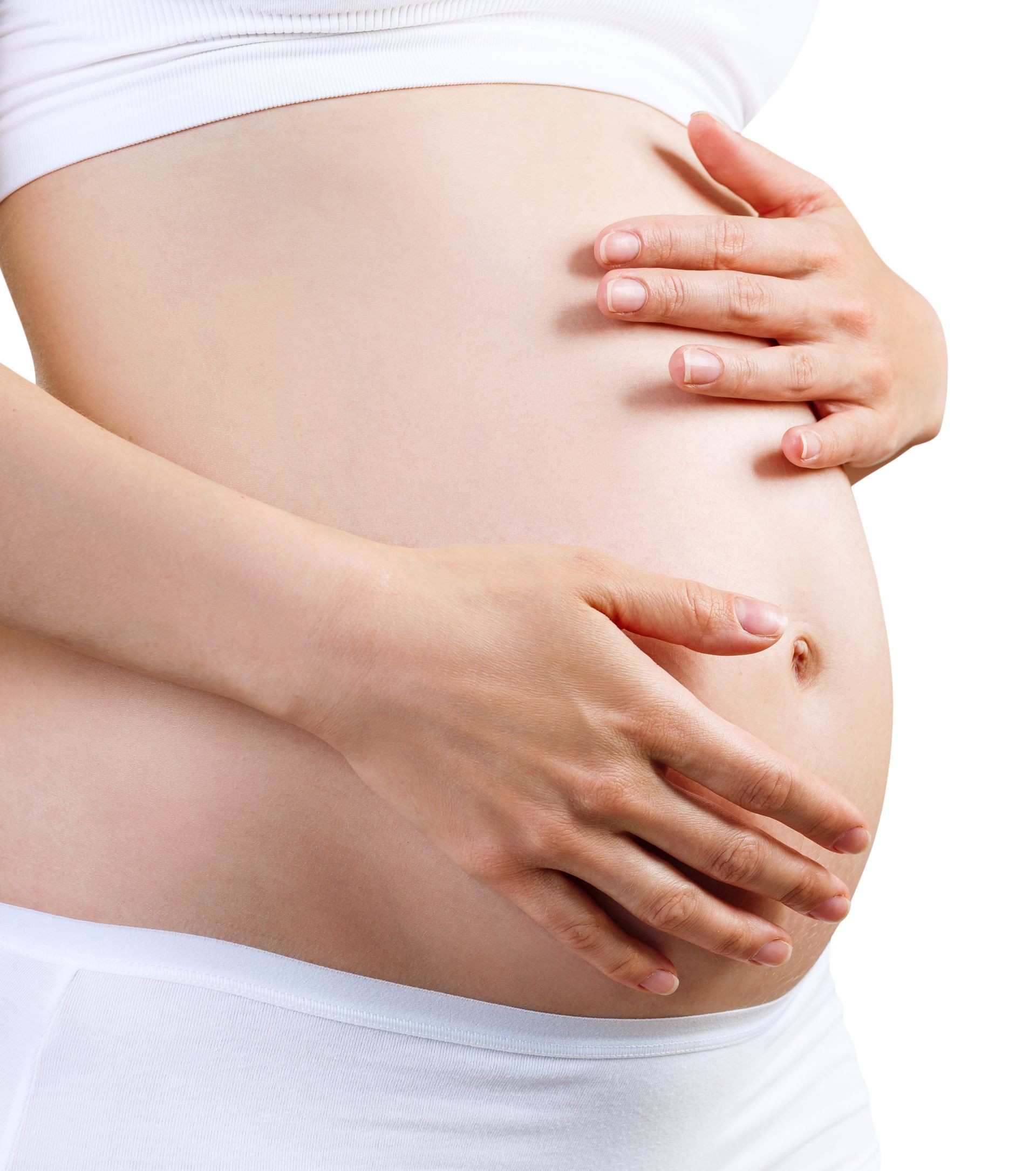 Young pregnant woman caress belly.